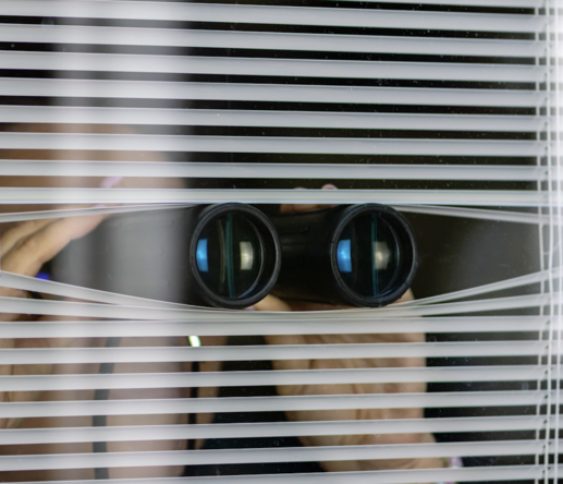Binoculars Watching Outside Window